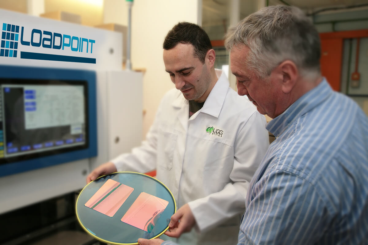 Lab technician showing customer precision cut optical material